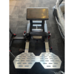 ARGO Fitness   Gym leg pressextension machine with perforated metal footplates and a padded seat
